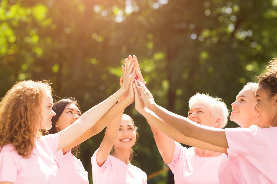 group of women giving high fives.